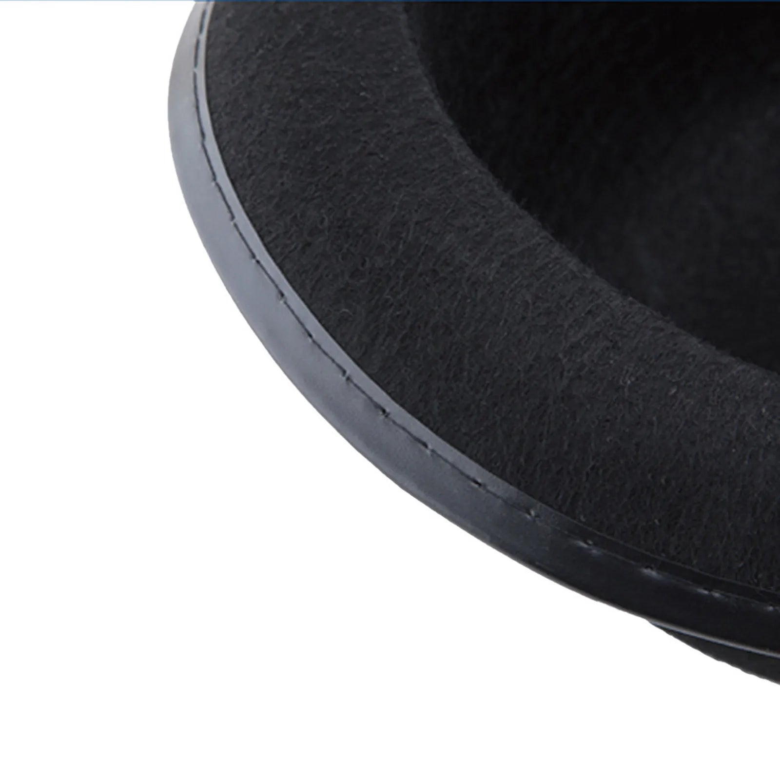 Close-up of a classic black felt-style fedora hat with a smooth, stitched brim edge.