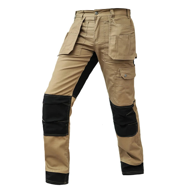 Tan and black cargo work trousers with reinforced knee pads, multiple utility pockets, and a button fly.