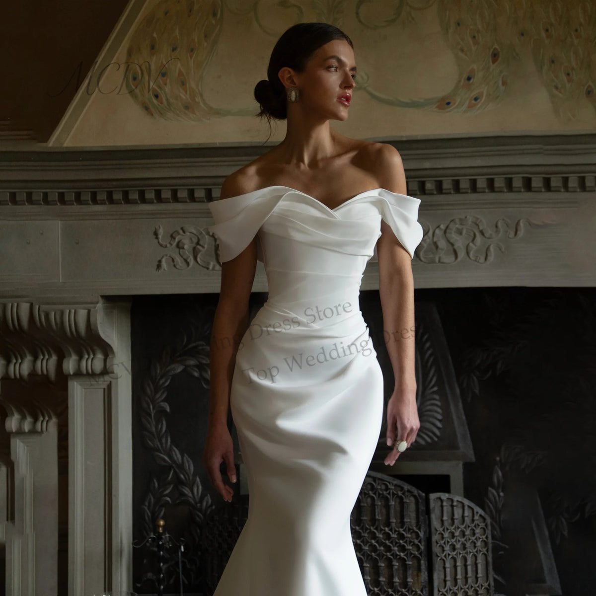 White off-the-shoulder satin mermaid wedding dress with sweetheart neckline and fitted bodice.