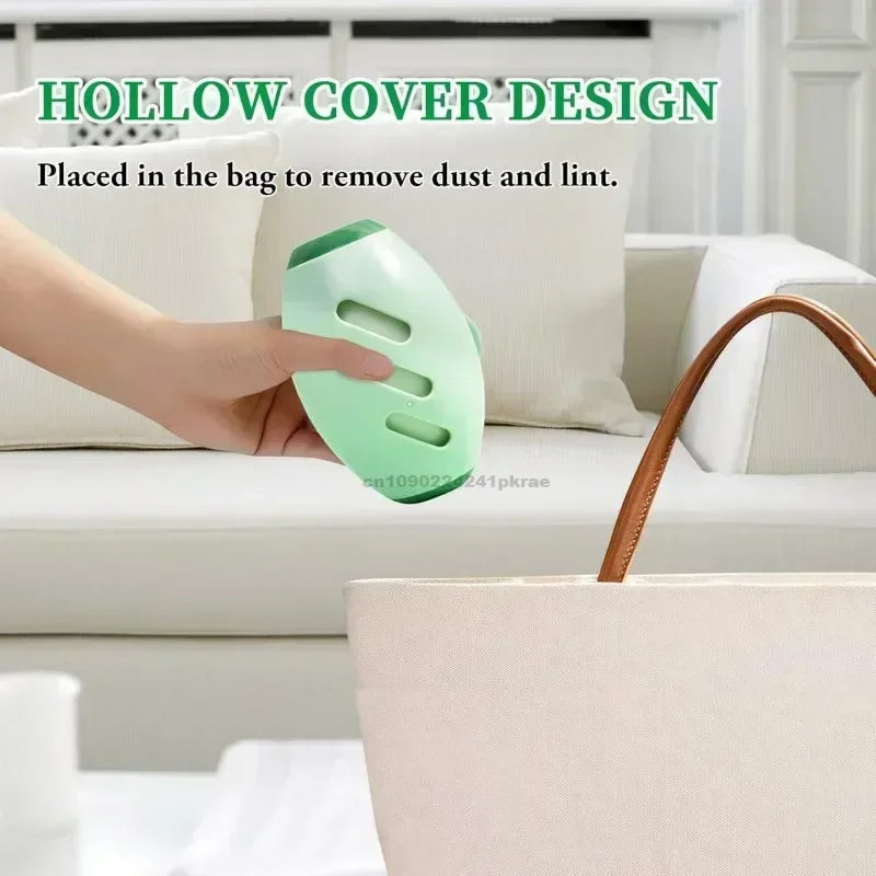 A hand holding a pale green, oval-shaped lint remover with a hollow, perforated design over a cream tote bag.