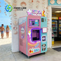 Pink and blue slushie vending machine with glowing neon lights, cartoon graphics, and "Slush Machine" sign.