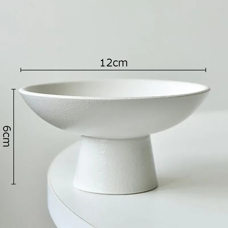 Minimalist white pedestal bowl with a textured matte finish, 12cm diameter and 6cm height.