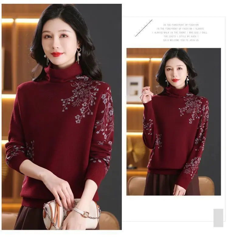 Burgundy turtleneck sweater with floral embroidery on the shoulder and sleeve, featuring long sleeves and a ribbed hem.