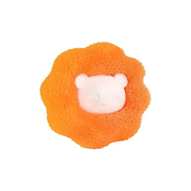 White panda-shaped soap set in a textured, bright orange, cloud-shaped sponge.