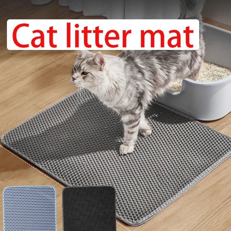 Large grey honeycomb cat litter mat on a wooden floor, with a cat stepping out of a litter tray onto it.