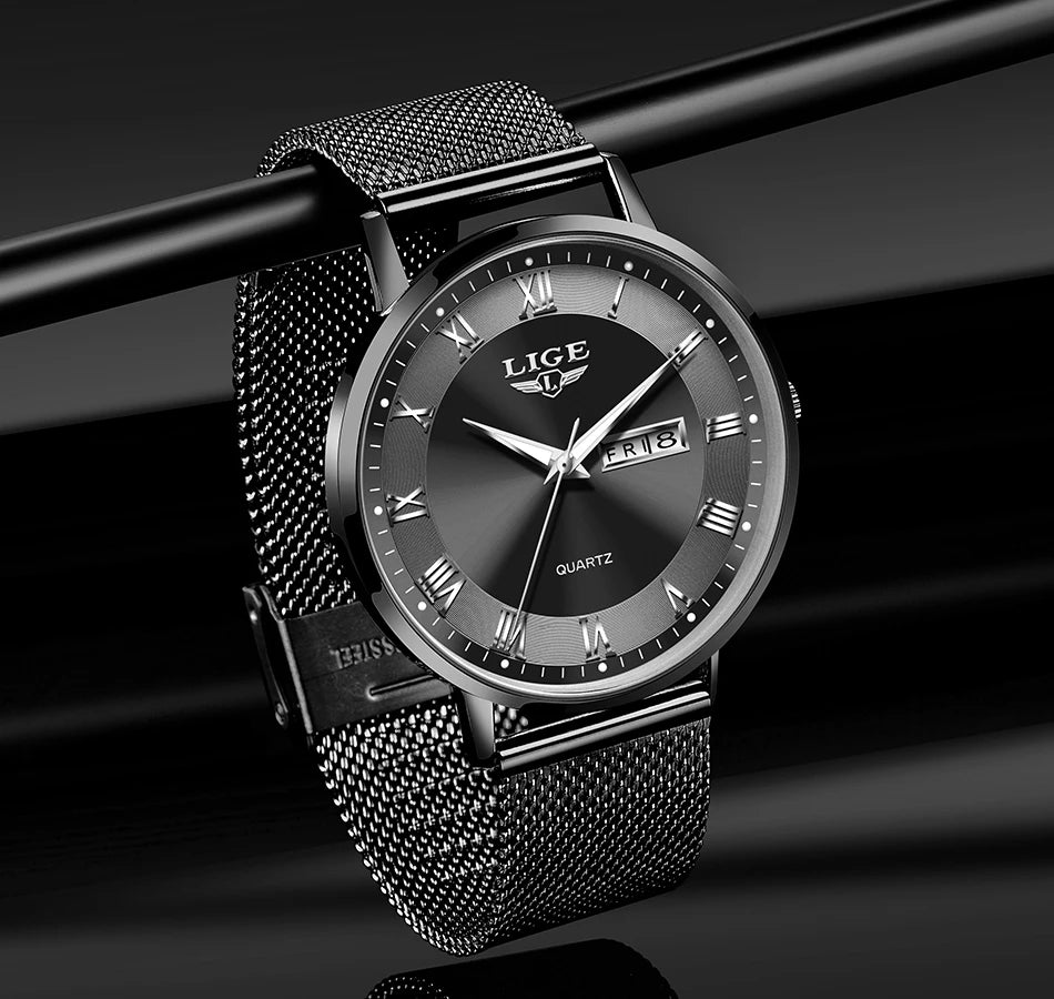 Elegant black stainless steel watch with a mesh strap, grey sunray dial, Roman numerals and a day-date window.