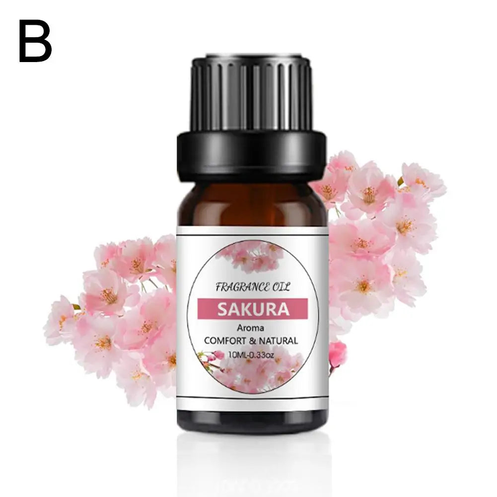 10ml amber glass bottle of Sakura fragrance oil with a black cap, set against a background of pink cherry blossoms.
