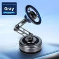 Gray alloy phone holder with an adjustable robotic arm and a round, textured magnetic mounting base.