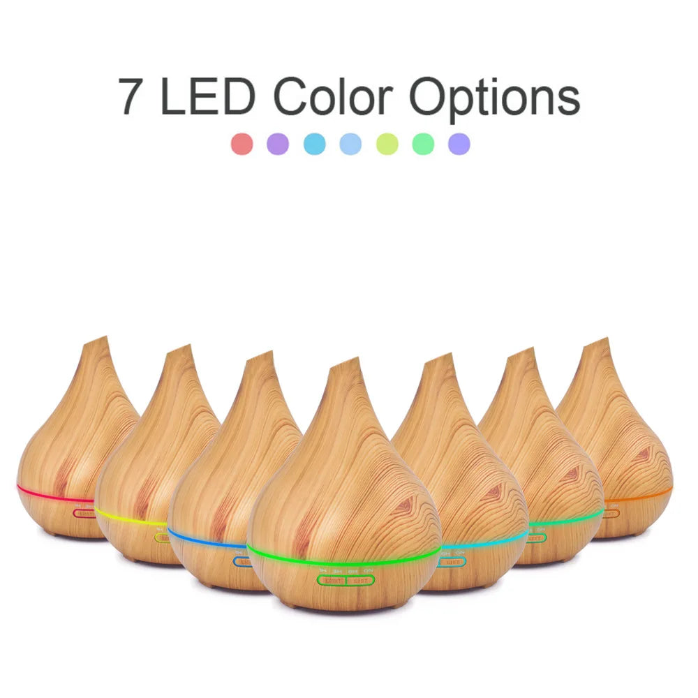 Teardrop-shaped wooden WiFi essential oil diffuser with seven customisable LED light colour settings.