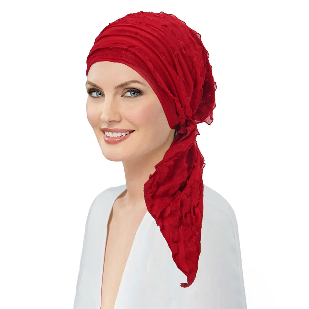 Model wearing a bright red, pre-tied, ruffled head wrap with an elasticated fit and elegant side-drape detail.