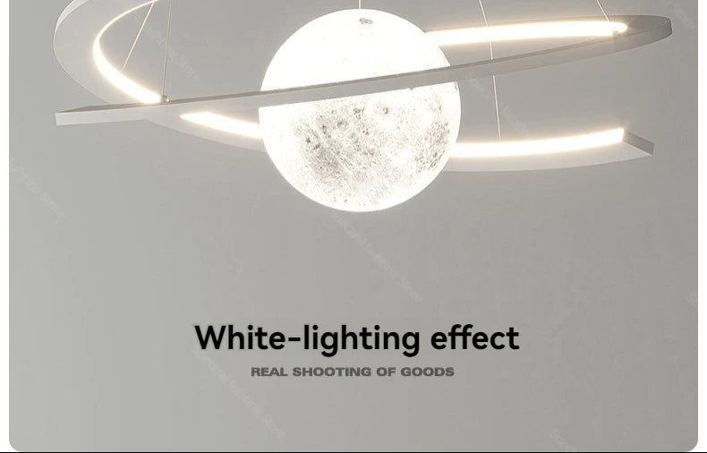 Modern white LED pendant lamp featuring a central illuminated moon-textured sphere surrounded by glowing ring lights.