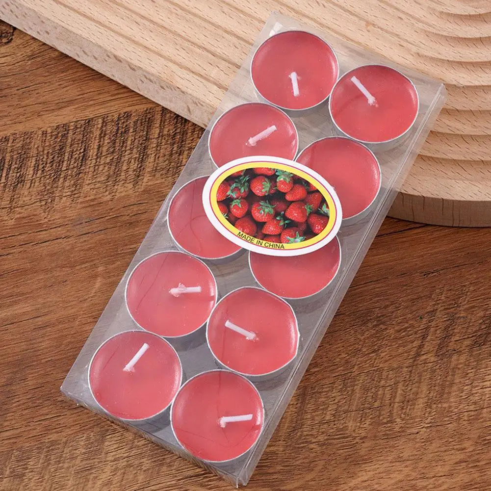 Pack of ten round red strawberry-scented tea light candles in clear plastic packaging.