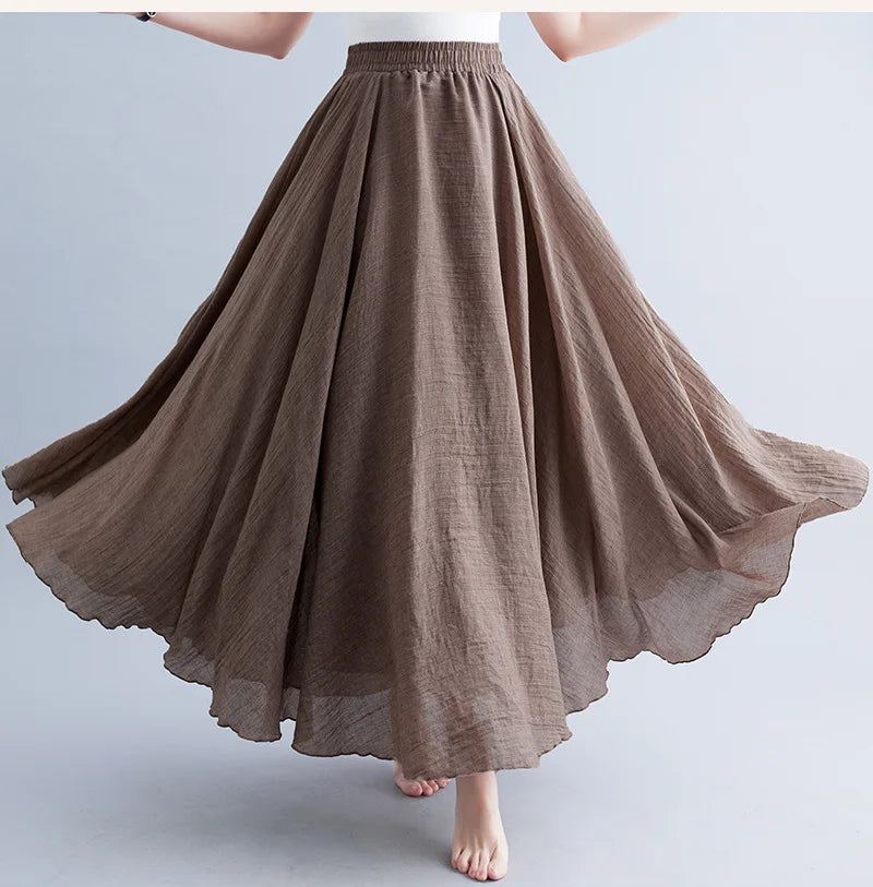 Flowing brown maxi skirt with an elasticated waistband and textured, lightweight fabric.