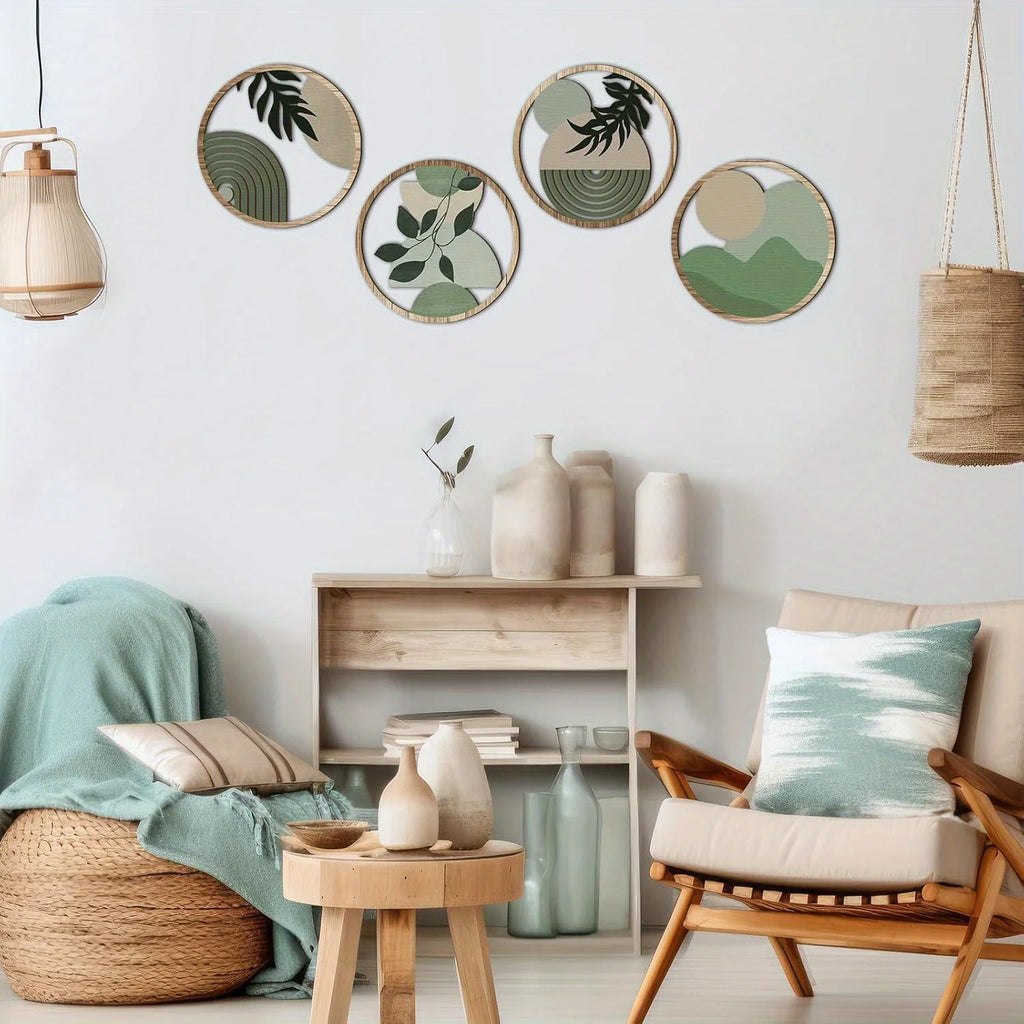 Four circular wooden wall art plaques featuring modern abstract botanical and geometric designs in shades of sage green.