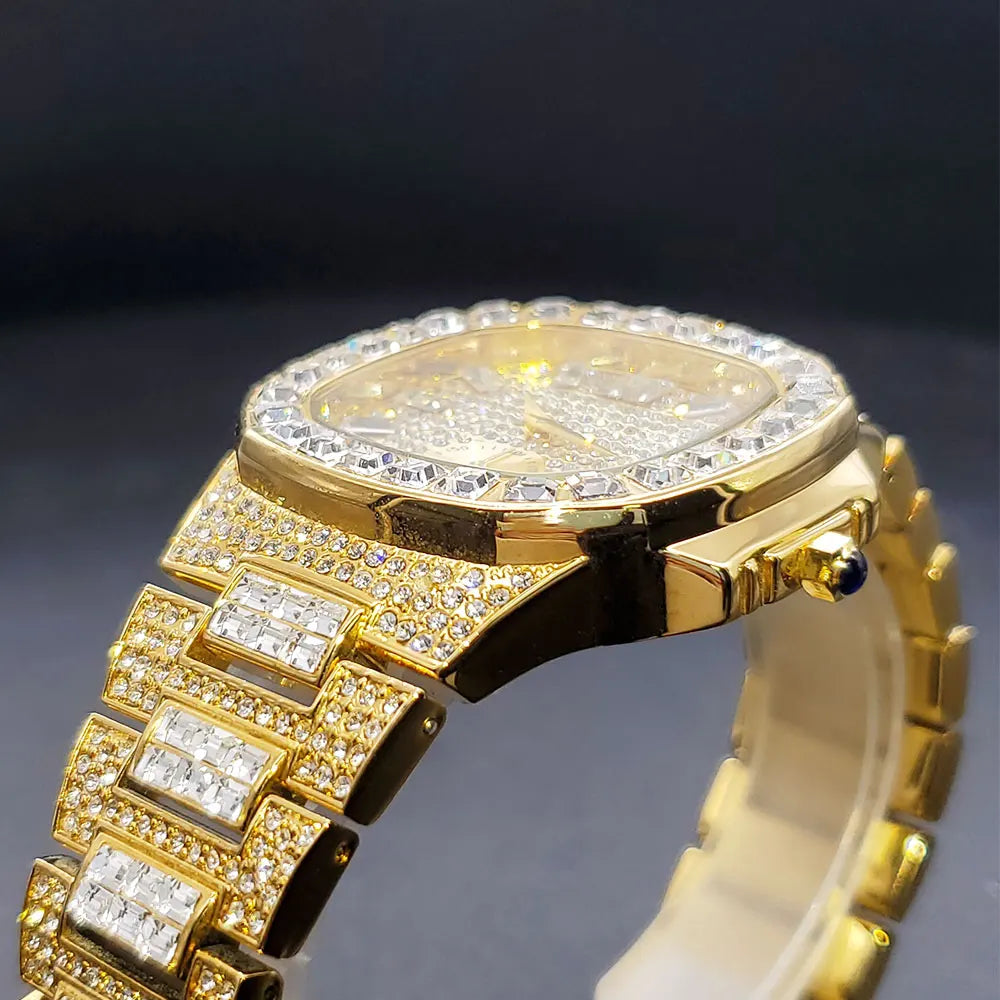 Gold iced-out men's quartz watch with a square face and a diamond-paved link bracelet encrusted with crystals.