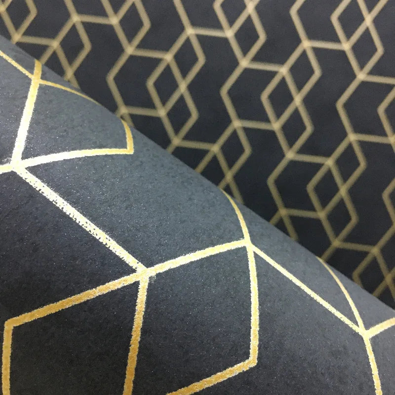 Modern charcoal wallpaper with a repeating gold metallic geometric cube pattern.