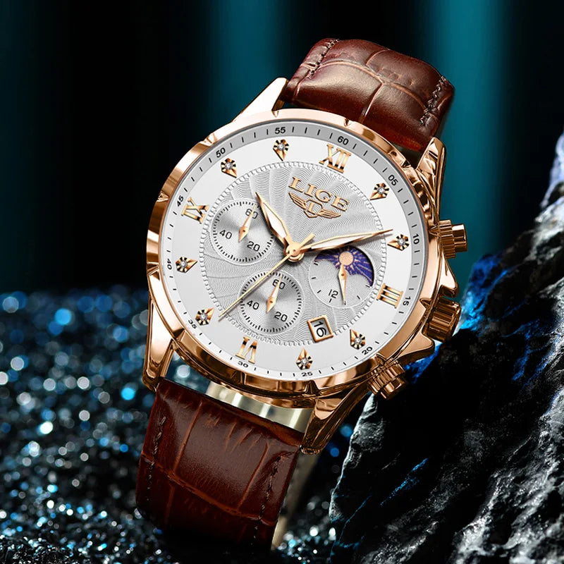 Men's gold-tone chronograph watch with a textured white dial, Roman numerals, and a brown crocodile-effect leather strap.