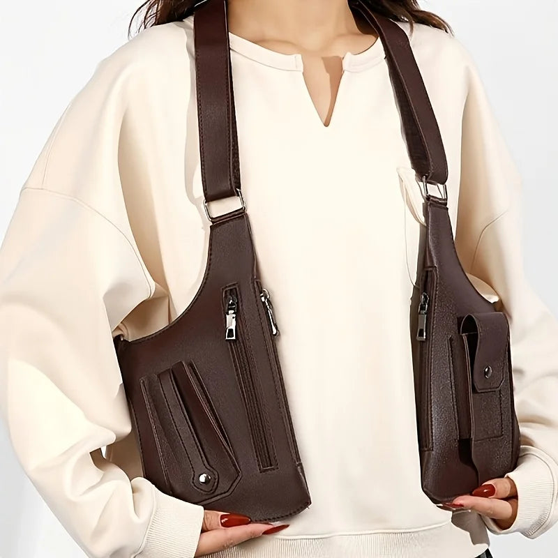 Dark brown multi-pocket utility chest bag with adjustable straps, worn over a cream-coloured sweatshirt.