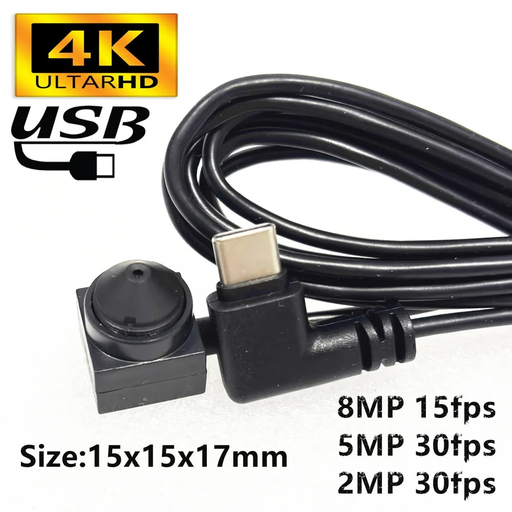 Black 4K USB-C pinhole camera module with a small lens, connected by a black cable. Size is 15x15x17mm.