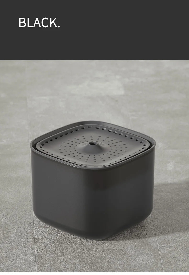 Matte black square pet water fountain with a perforated top tray and central spout, minimalist design.