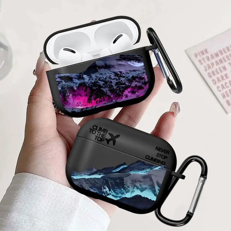 Black mountain-print hard shell case for Apple AirPods Pro with carabiner clip.