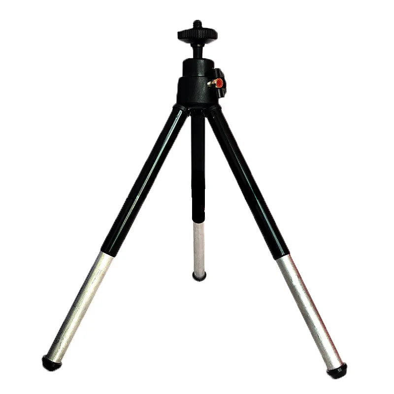 Black and silver compact tabletop tripod with a rotating ball head and adjustable telescopic legs.