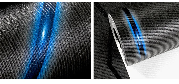 Modern black wallpaper roll with a textured 3D ribbed surface and a striking, reflective blue diagonal stripe.