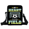 Black crossbody bag with "My heart is on that field" football goal print and adjustable shoulder strap.