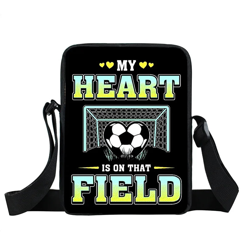 Black crossbody bag with "My heart is on that field" football goal print and adjustable shoulder strap.