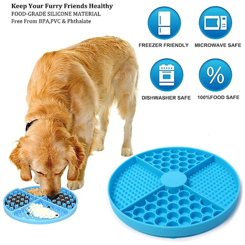A golden dog eating from a round, blue silicone slow-feeder mat with textured compartments for food.