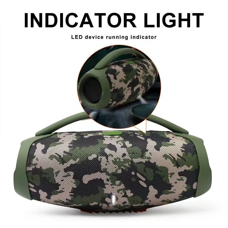 Portable camo-pattern Bluetooth speaker with a green carry handle and glowing LED indicator light.