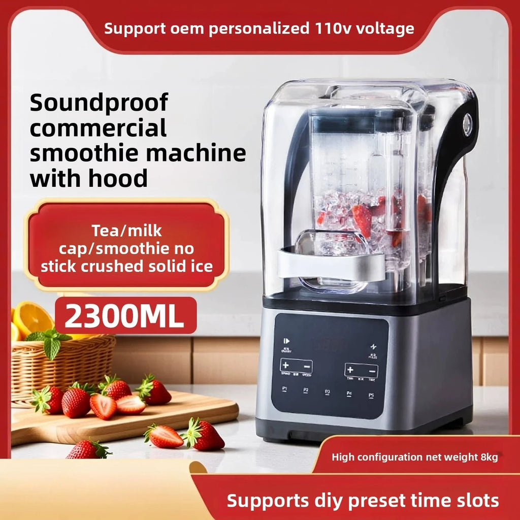 Silver commercial blender with clear soundproof hood enclosing a pitcher filled with ice and strawberries.