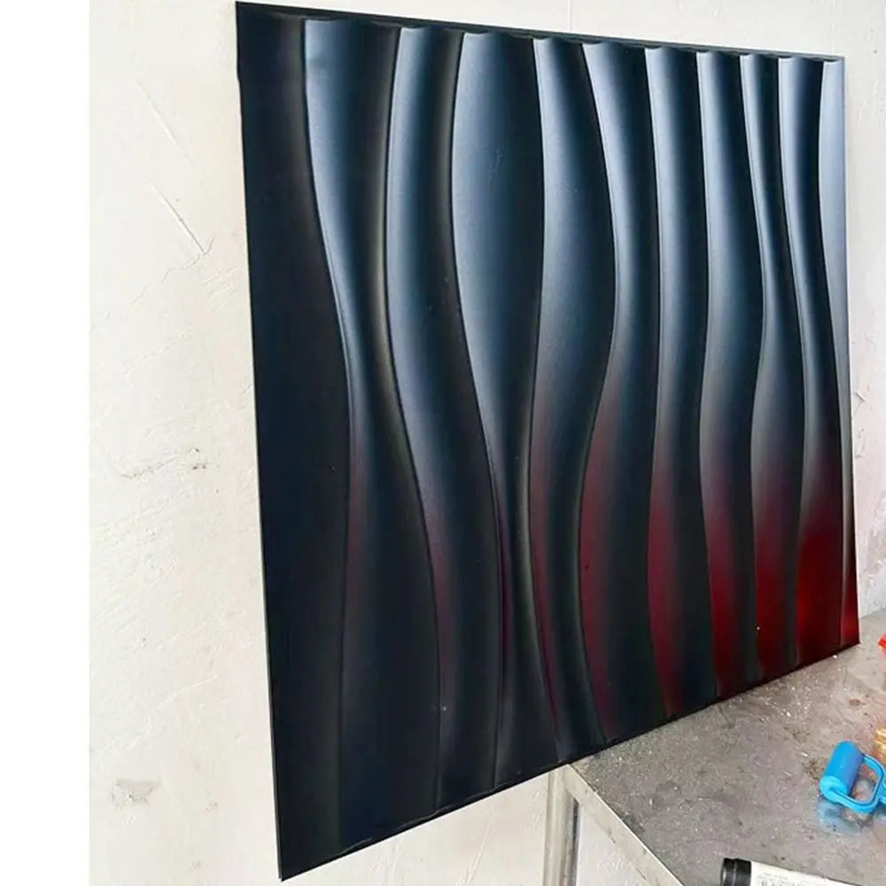 Black 3D decorative wall panel with a modern, vertical wavy texture. Waterproof design for stylish wall cladding.