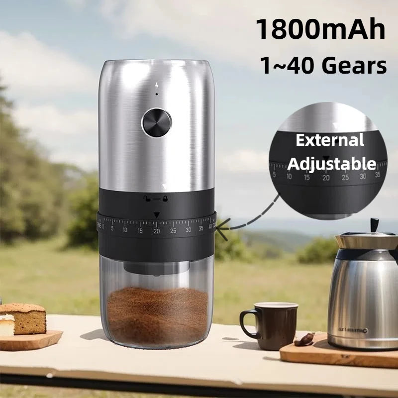 Portable stainless steel electric coffee grinder with an adjustable black gear dial and clear grounds container.