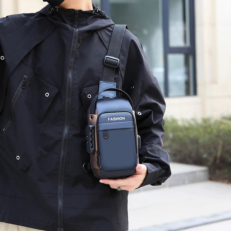 A navy blue anti-theft chest bag with a USB port and combination lock, worn crossbody over a black jacket.