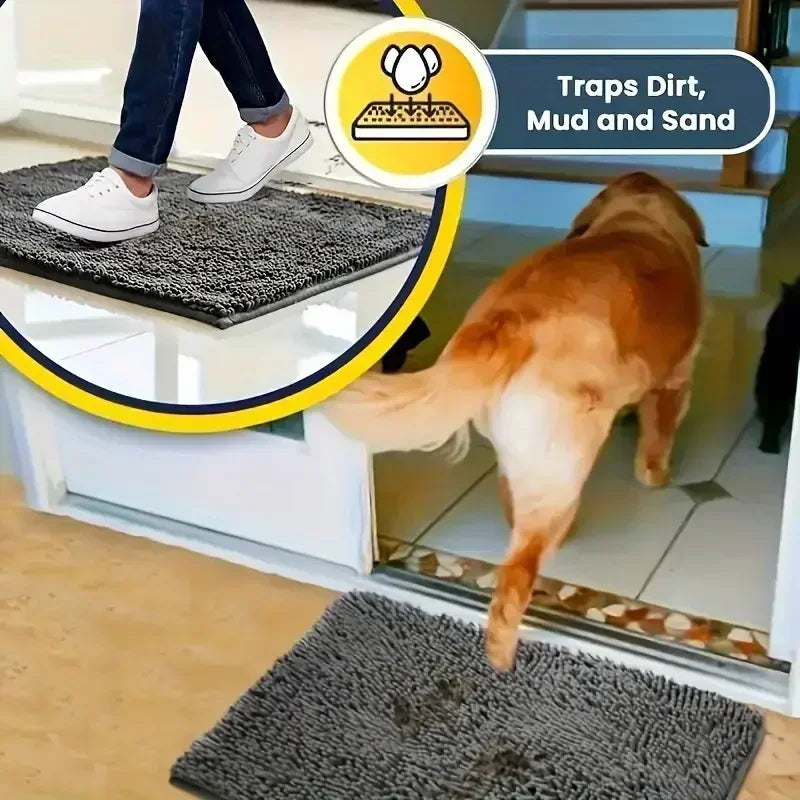 Grey textured absorbent doormat on a floor with a dog walking across it, designed to trap dirt, mud, and sand.
