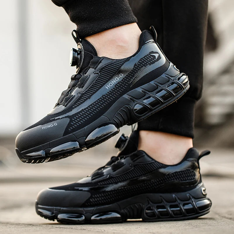 Black steel-toe safety trainers with a sleek, sporty design, mesh detailing, and dial-lace closure system.