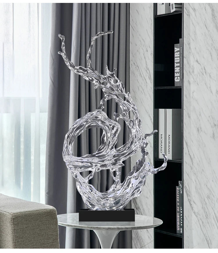 Clear, abstract resin ornament with a fluid, water-splash design on a black base, styled in a modern living room.