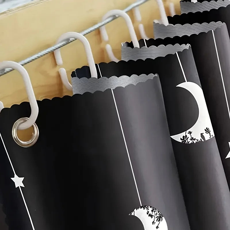 Blackout privacy curtain for bunk beds in black with a white moon and star pattern, featuring a scalloped top edge.