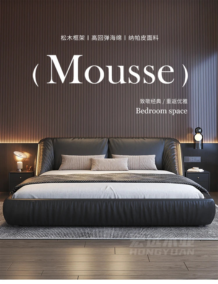 Modern, charcoal grey upholstered king-size bed frame with a sleek, curved headboard and integrated side lighting.