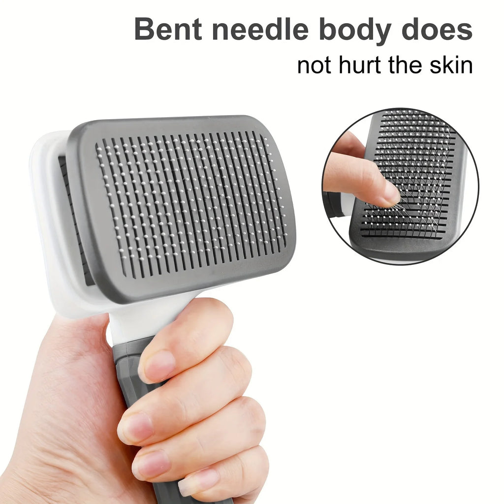 Grey and white pet slicker brush with bent needles held in a hand. Inset shows detail of soft-tipped bristles.
