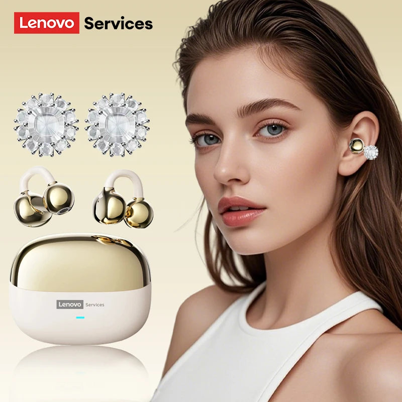 Gold and white clip-on earbud headphones with decorative crystal charms and a matching charging case.