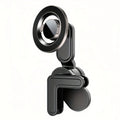 Black magnetic car phone mount with circular head and L-shaped vent clip, featuring sleek, minimalist industrial design.