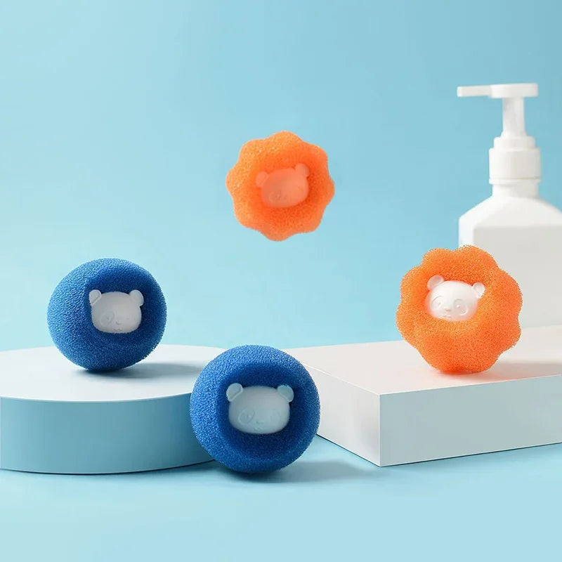 Blue and orange textured sponge balls with cute white panda faces on display against a light blue background.