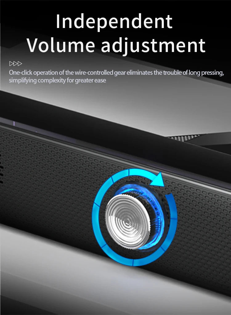 Black computer soundbar with a silver rotary volume dial featuring a glowing blue light effect for easy adjustment.