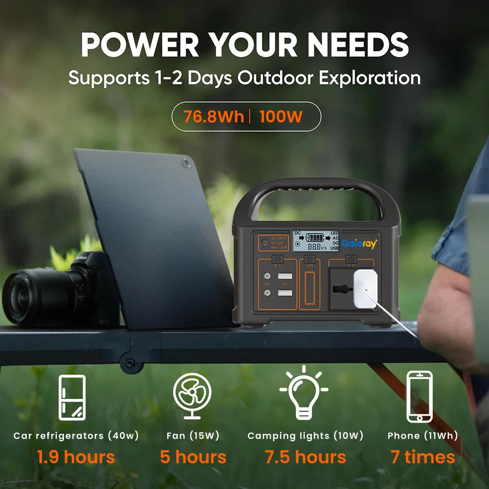 Portable power station with digital display and handle, connected to a charger, on an outdoor table.