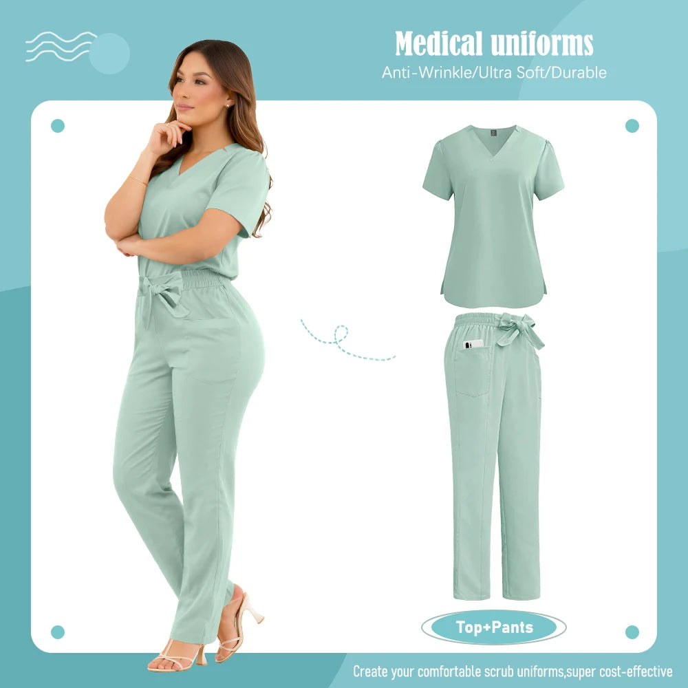 A model wearing a sage green V-neck scrub top and matching trousers with a tie-waist and side pockets.