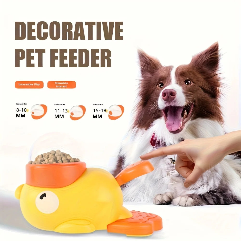 Interactive yellow pet feeder shaped like a fish, featuring an orange top, transparent dome, and food dispensing mechanism.