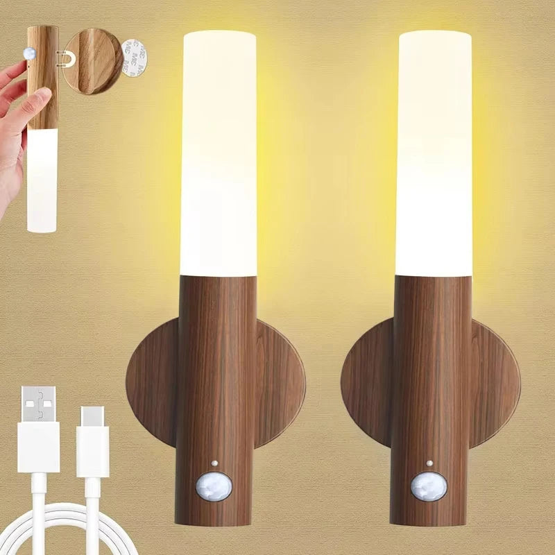 Two modern, wood-finish rechargeable LED wall lights with integrated motion sensors and soft warm lighting.
