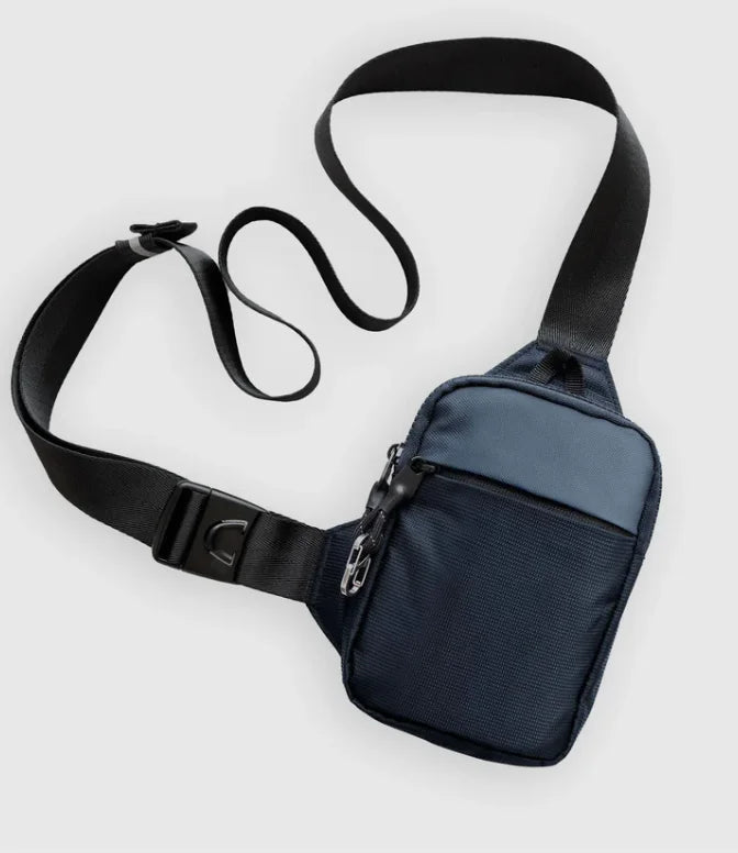 Navy blue unisex anti-theft nylon crossbody sling bag with a secure buckle strap and zippered front pocket.